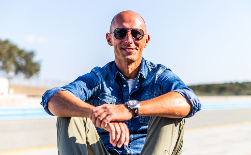 Marco Borraccino, trackside at Mazda Raceway Laguna Seca, sporting his “Track 1" Singer Reimagined chronograph. Photo Credit: Kurt Bradley